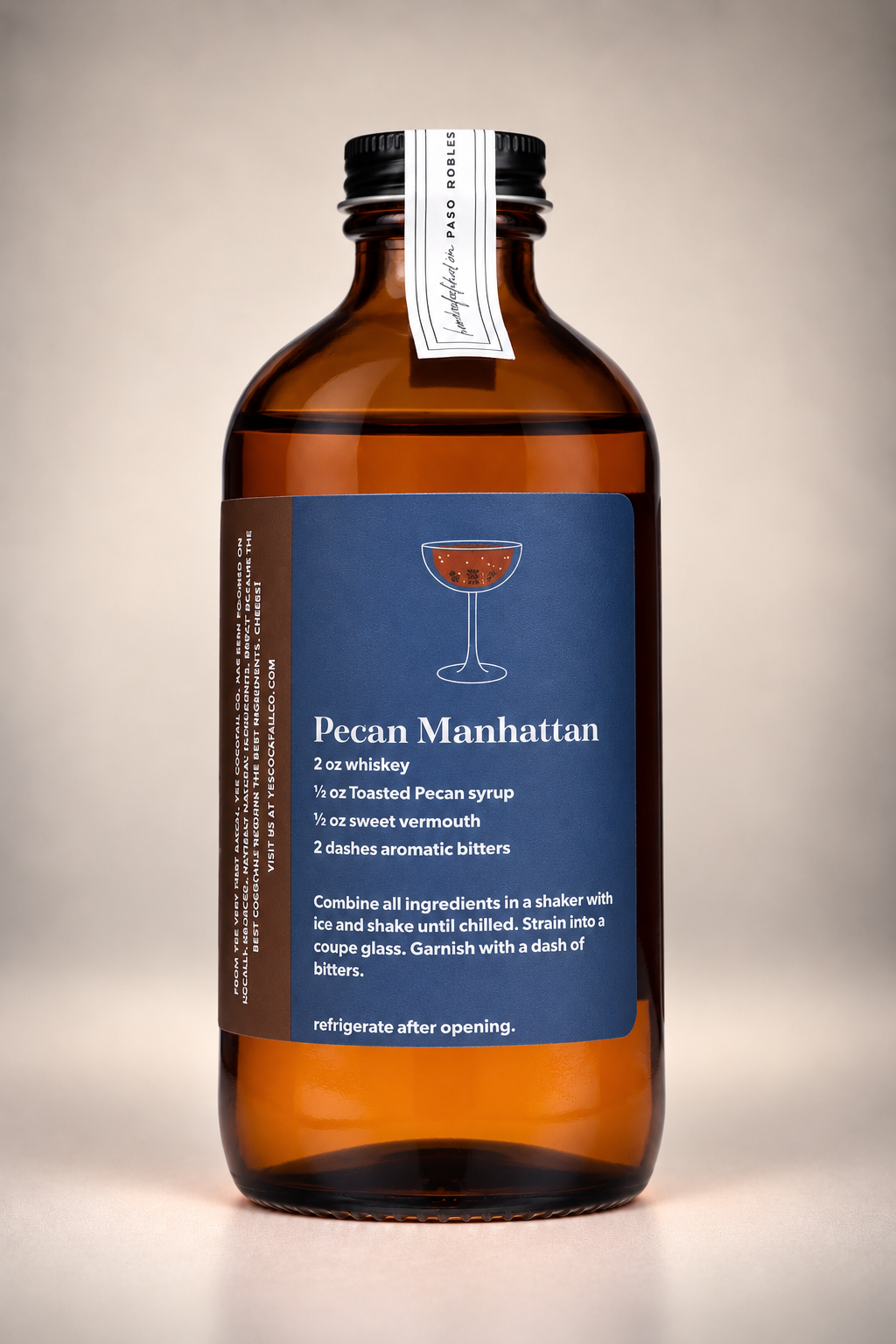 Back of Yes Cocktail Co. Toasted Pecan Syrup bottle displaying a Pecan Manhattan recipe made with whiskey, sweet vermouth, and aromatic bitters.