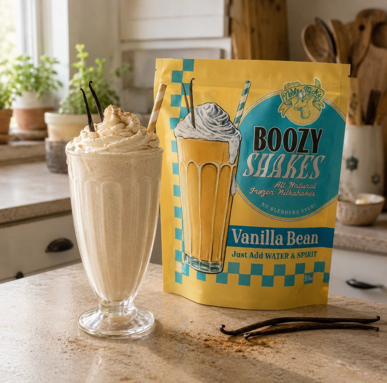 Creamy Vanilla Bean frozen boozy shake topped with whipped cream beside a pouch of Noble Mick’s Vanilla Bean Boozy Shakes mix.