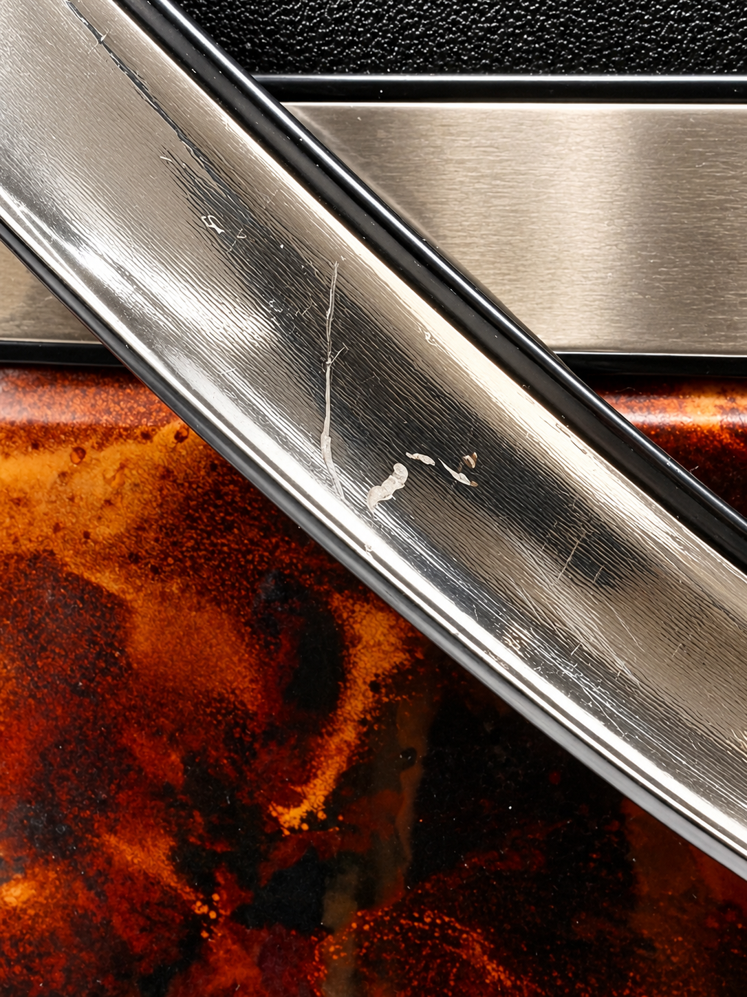 Detailed view of Elmar ice bucket swing handle showing scratches and areas of finish wear.