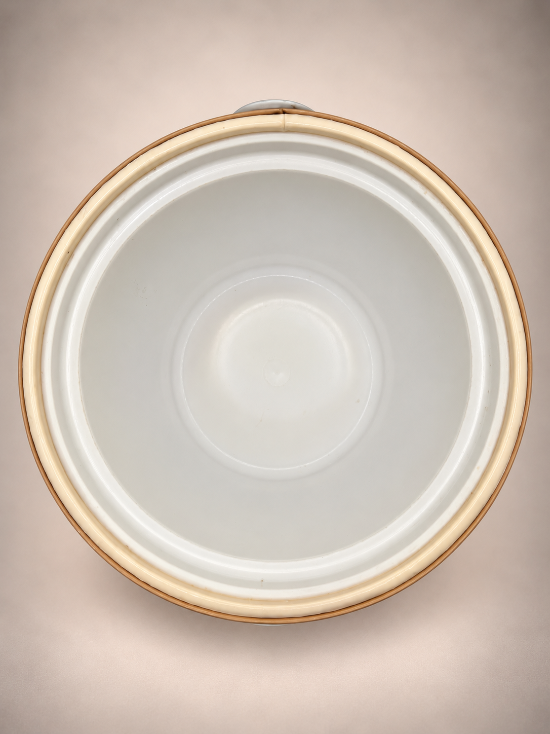 Overhead view showing the white interior liner of a vintage Georges Briard ice bucket.