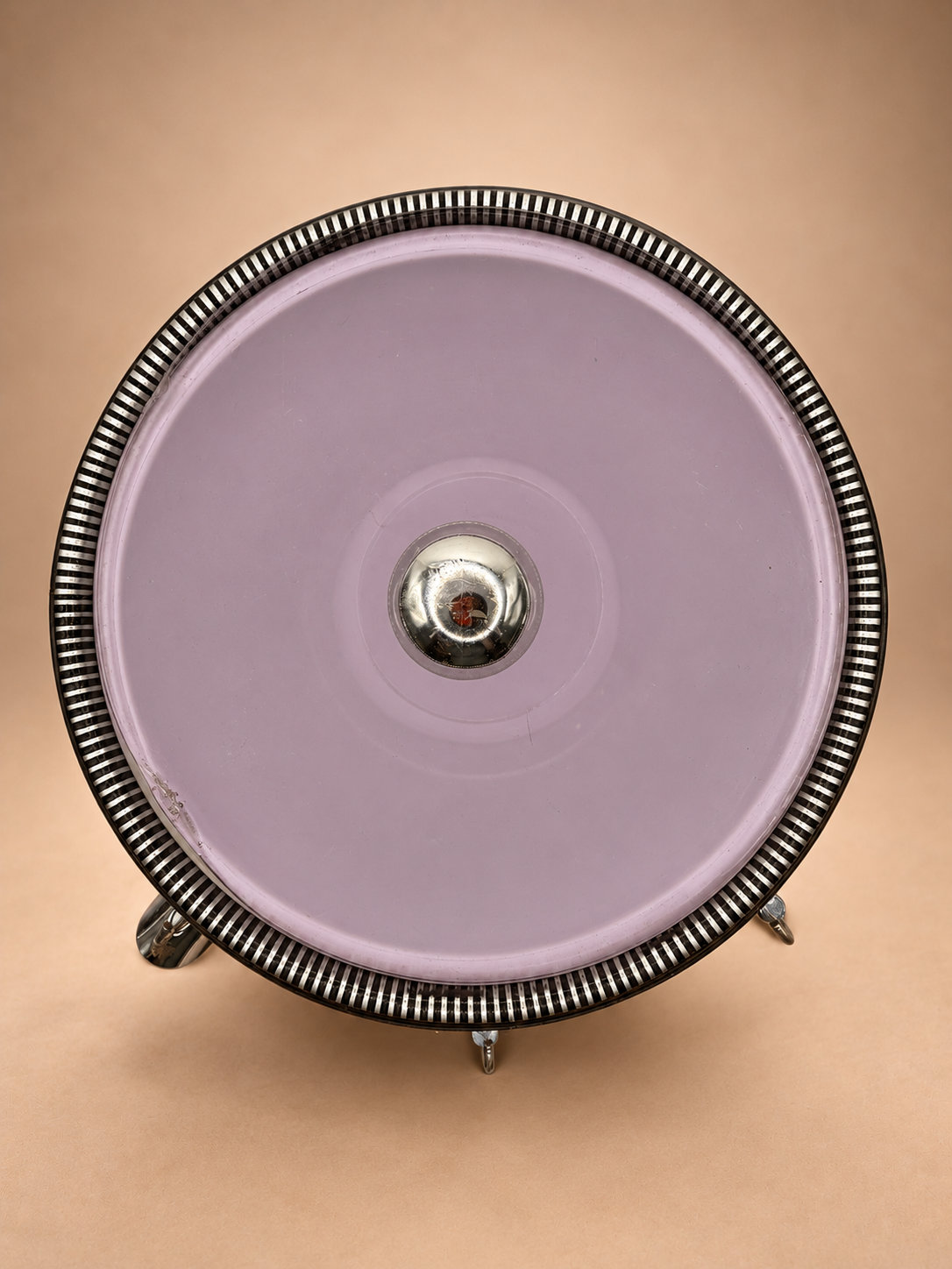 Overhead view of translucent tinted vintage ice bucket lid showing small chip along edge and striped rim.