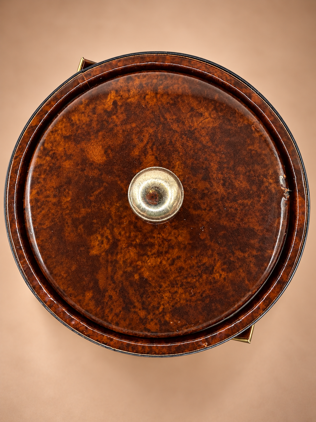 Overhead view of vintage ice bucket showing glossy tortoiseshell-style brown lid and round gold-tone finial.