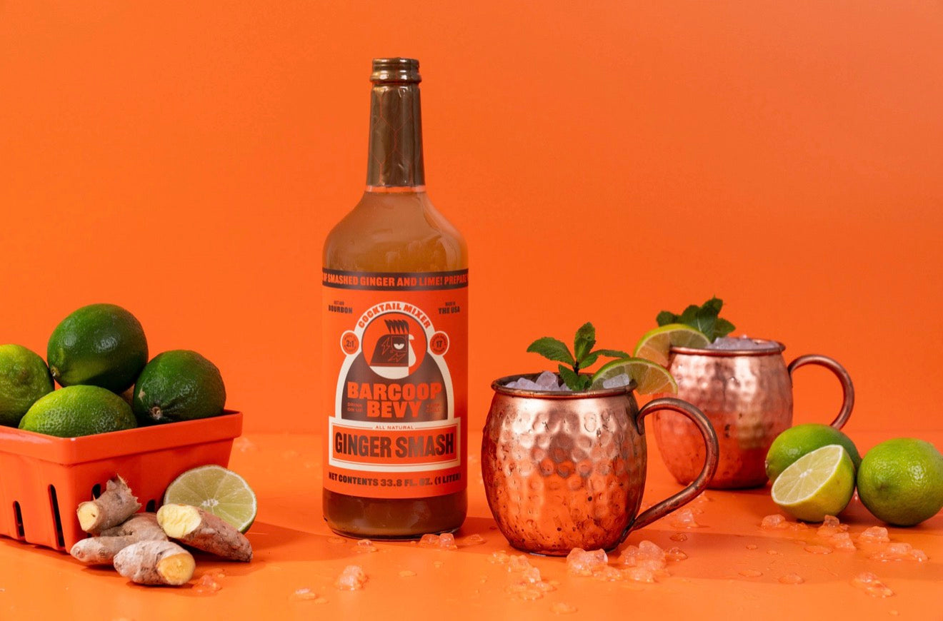 Barcoop Bevy ginger smash mixer used in copper mugs with lime and mint garnish
