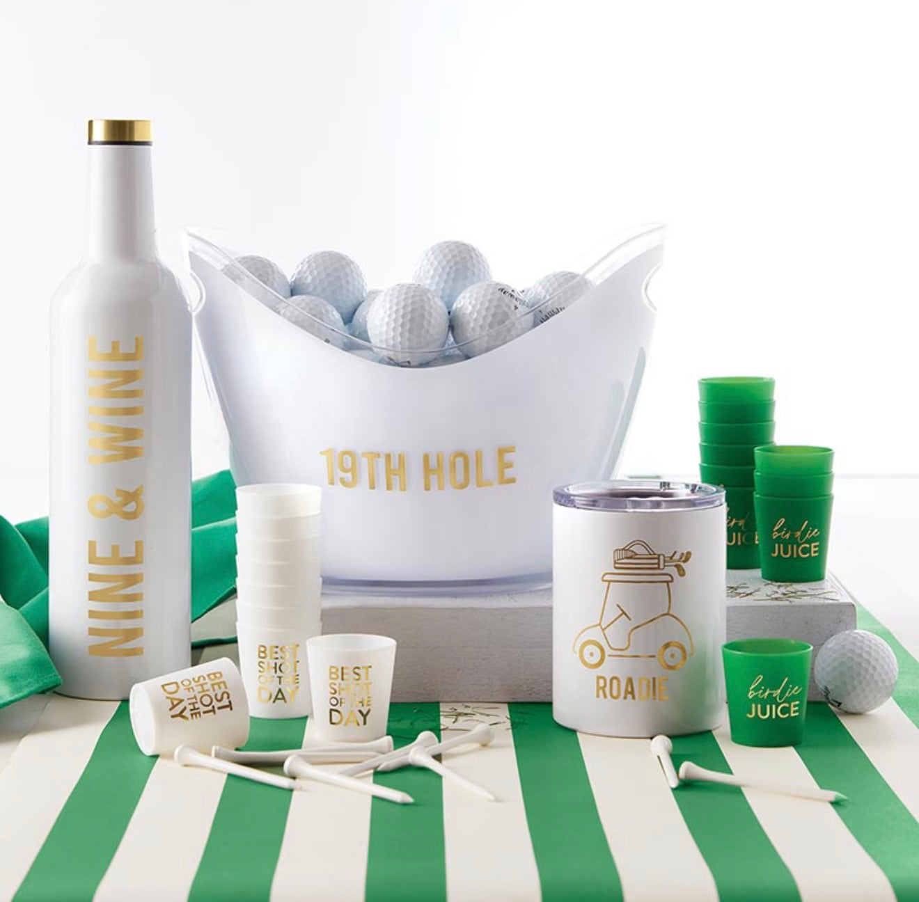 Golf themed party setup with Birdie Juice shot cups, golf balls, drinkware, and entertaining accessories.