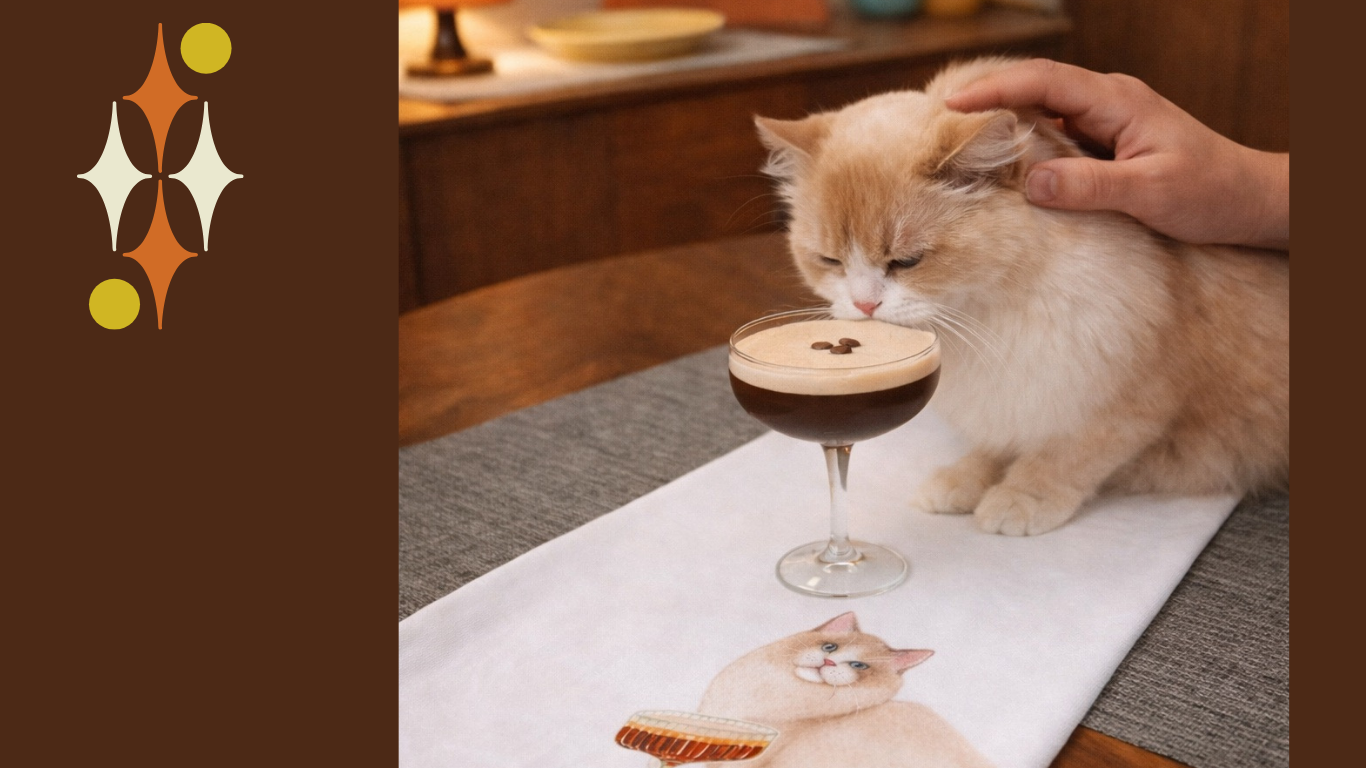 Fluffy cat beside an espresso martini cocktail on a cat-themed kitchen towel – playful cocktail gift for cat lovers