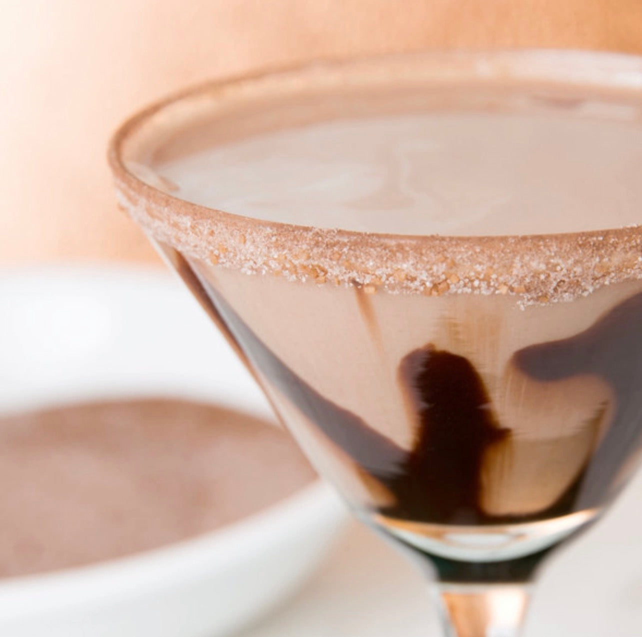 Chocolate martini with cocoa sugar rim and chocolate swirl garnish using rokz Chocolate Martini Sugar.
