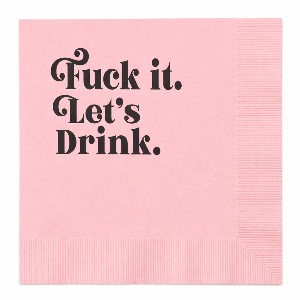 Pink cocktail napkin with black foil text reading Fuck It Let’s Drink on white background