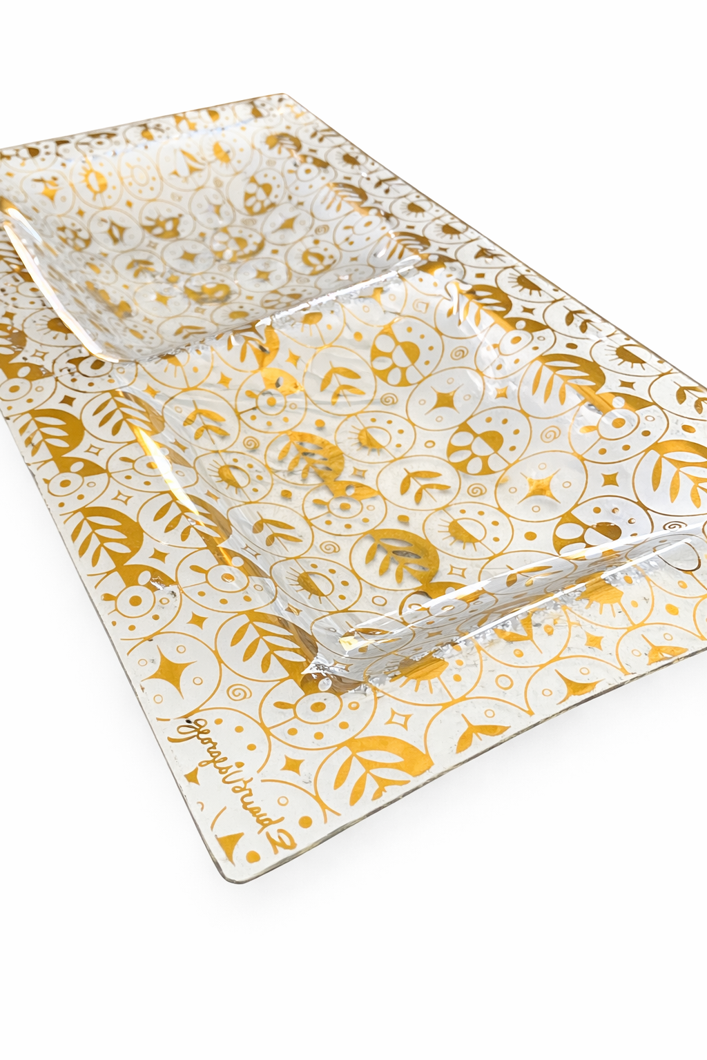 Angled view of Georges Briard 22K gold glass platter showing curved edges and gold detailing