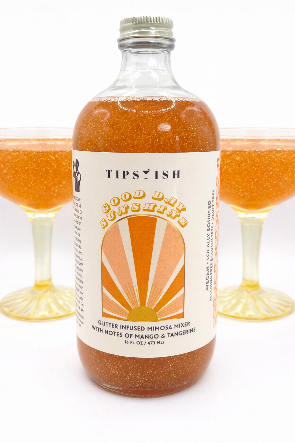 Good Day Sunshine glitter mimosa mixer with sparkling mango tangerine mimosas in coupe glasses
