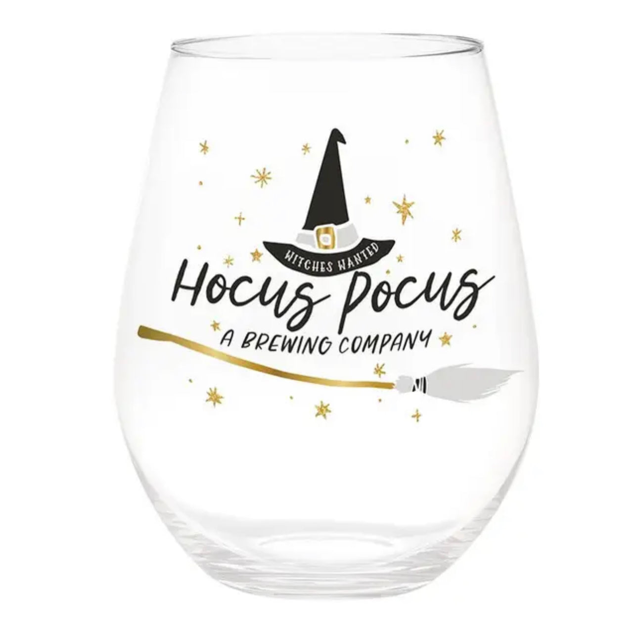 clear, stemless wine glass decorated with a witches hat and broom surrounded by stars with the words "witches wanted, Hocus Pocus, A brewing company"