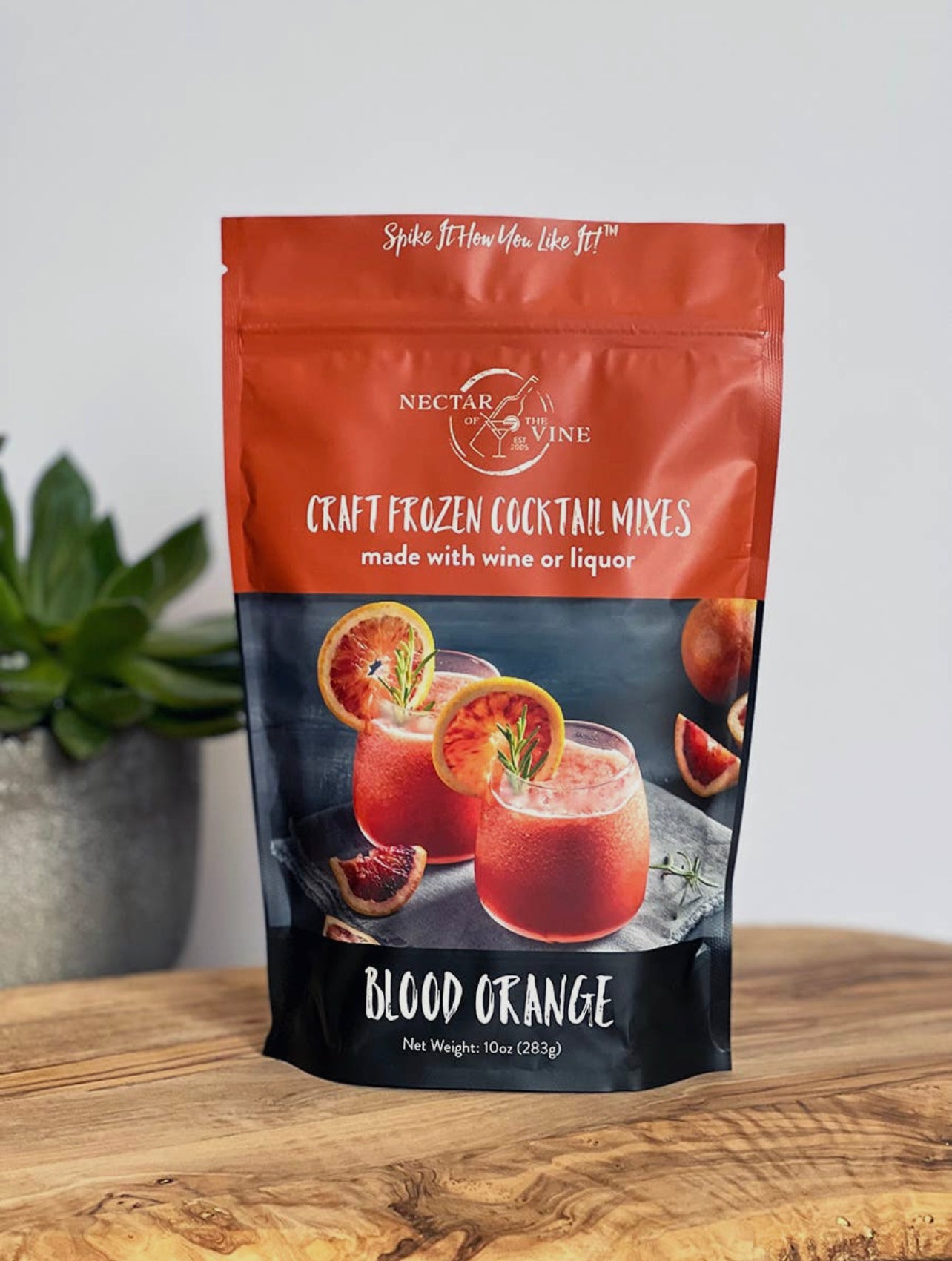 package of blood orange craft frozen cocktail mix displayed on a wooden table