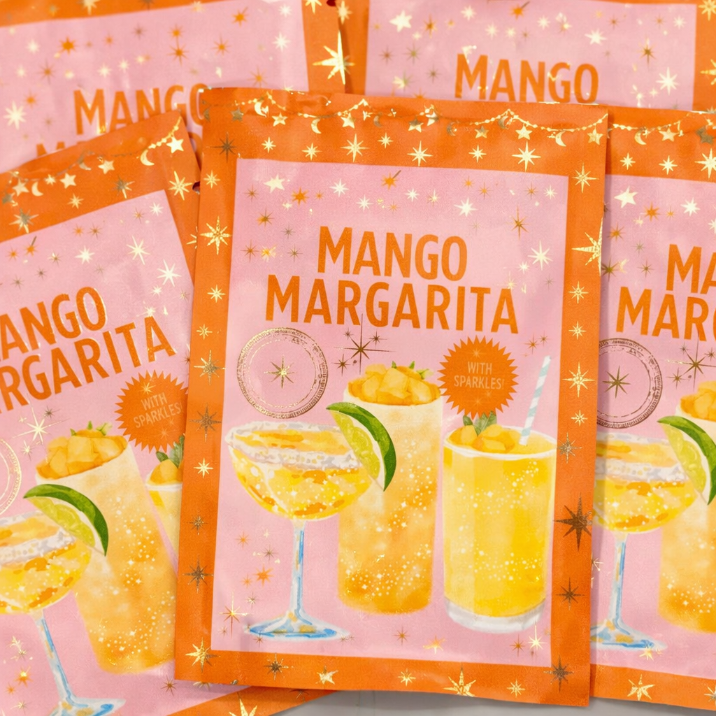 Mango Margarita craft cocktail mixer packets by Practical Magic with illustrated margarita glasses and mango garnish