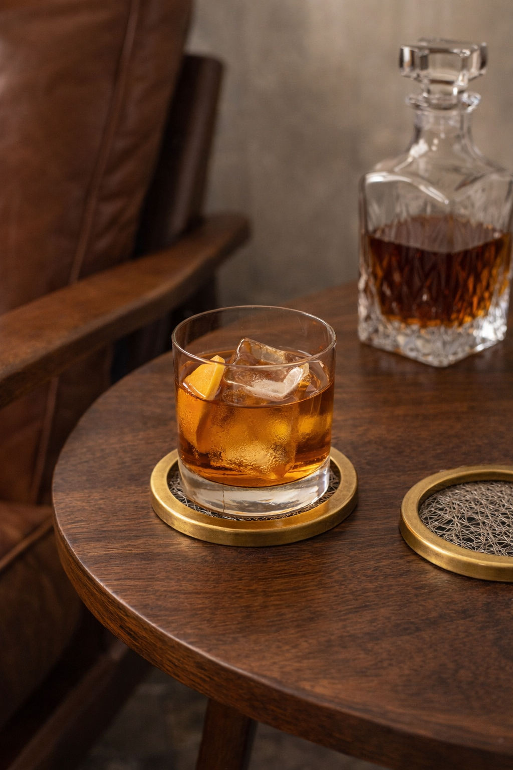 Vintage brass lucite coasters styled with old fashioned cocktail on mid century bar table