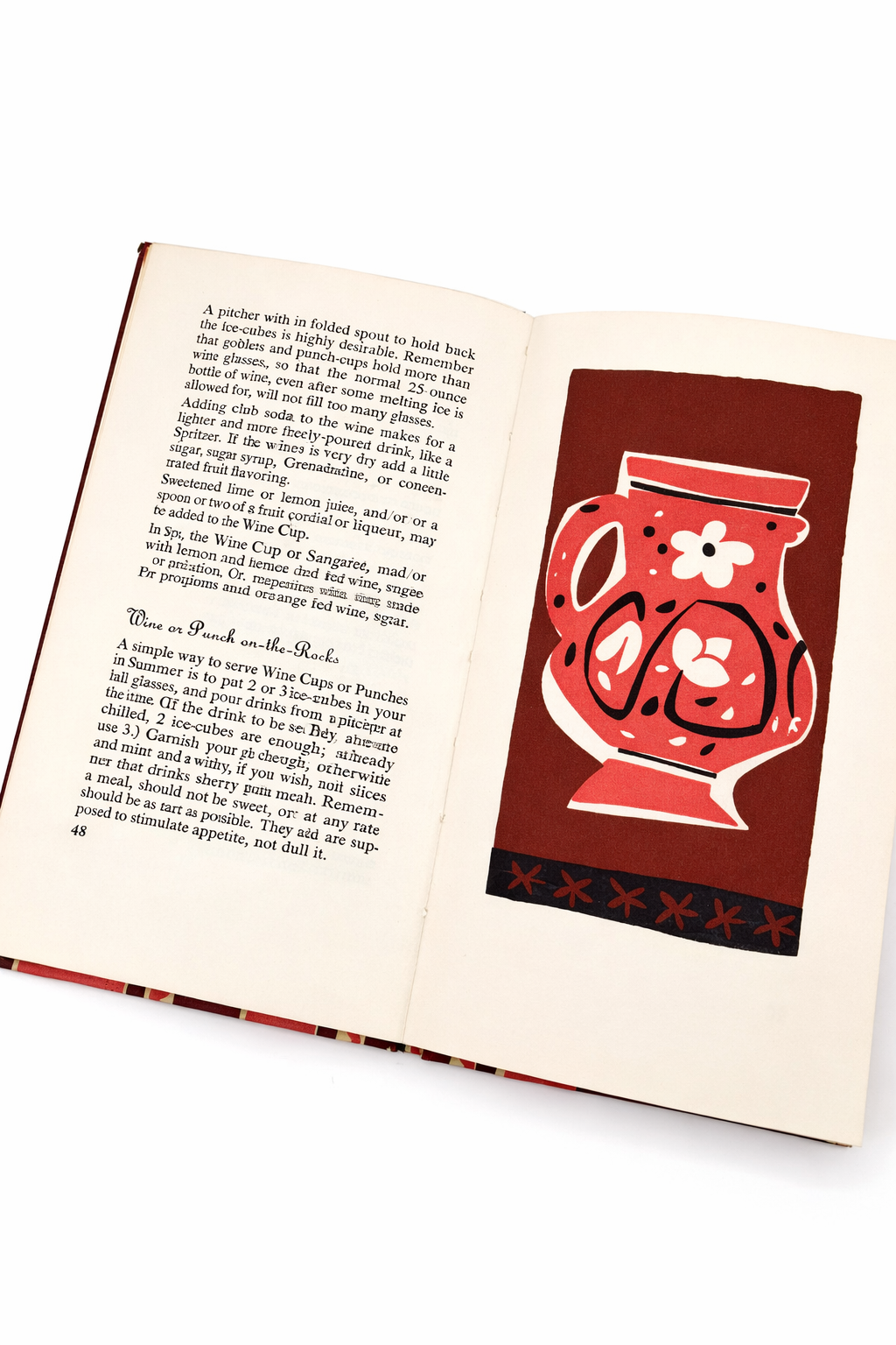 Mid century modern cocktail illustration of red pitcher inside vintage Peter Pauper drink book