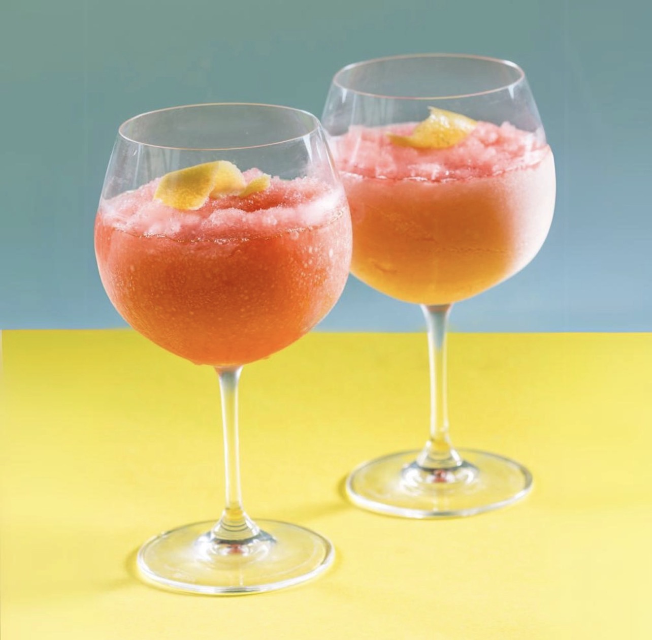 Frozen rosé cocktails in wine glasses made with Noble Mick’s Frosé frozen cocktail mix