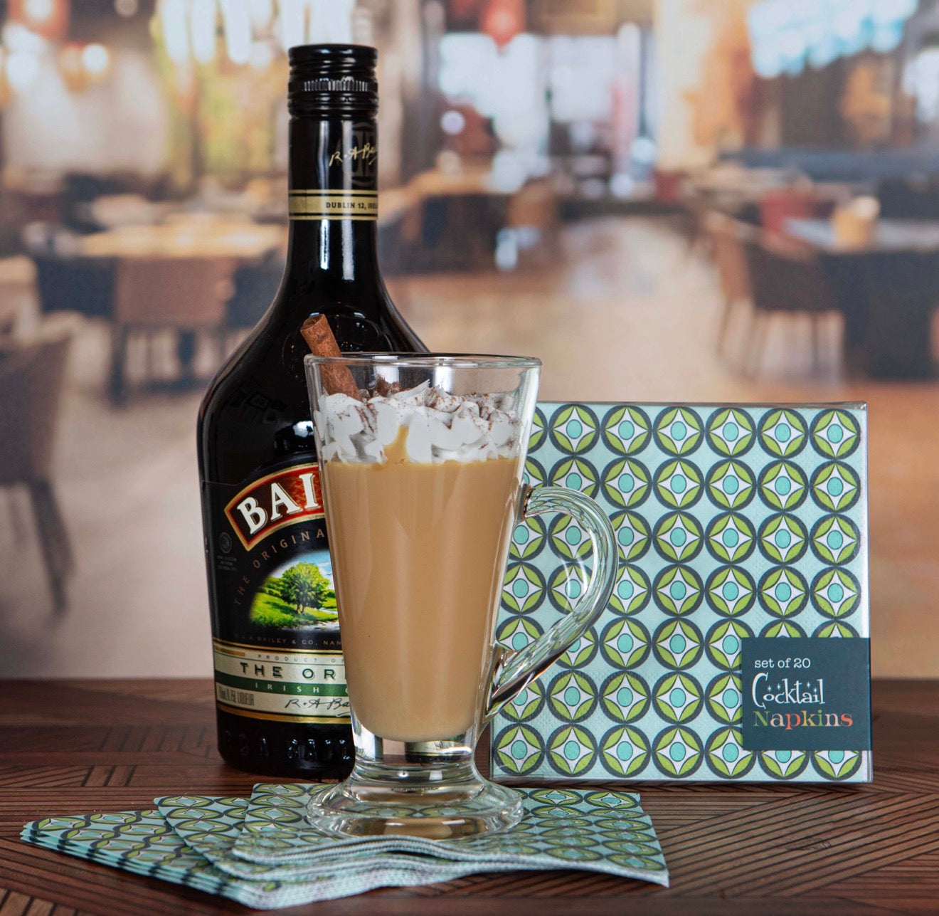 Blue raindrop circle cocktail napkins styled with Irish coffee drink and bar setup.