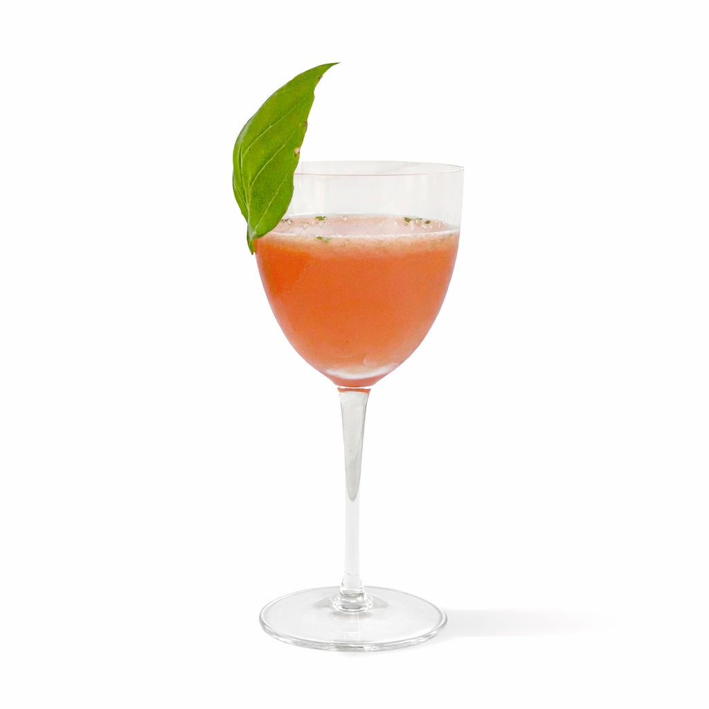 Strawberry Rose spritz cocktail made with Morris Kitchen mixer and basil garnish