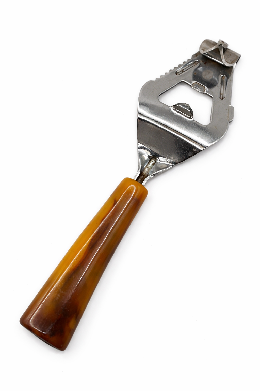 Close up of vintage Bakelite bottle opener with amber and caramel marbled handle
