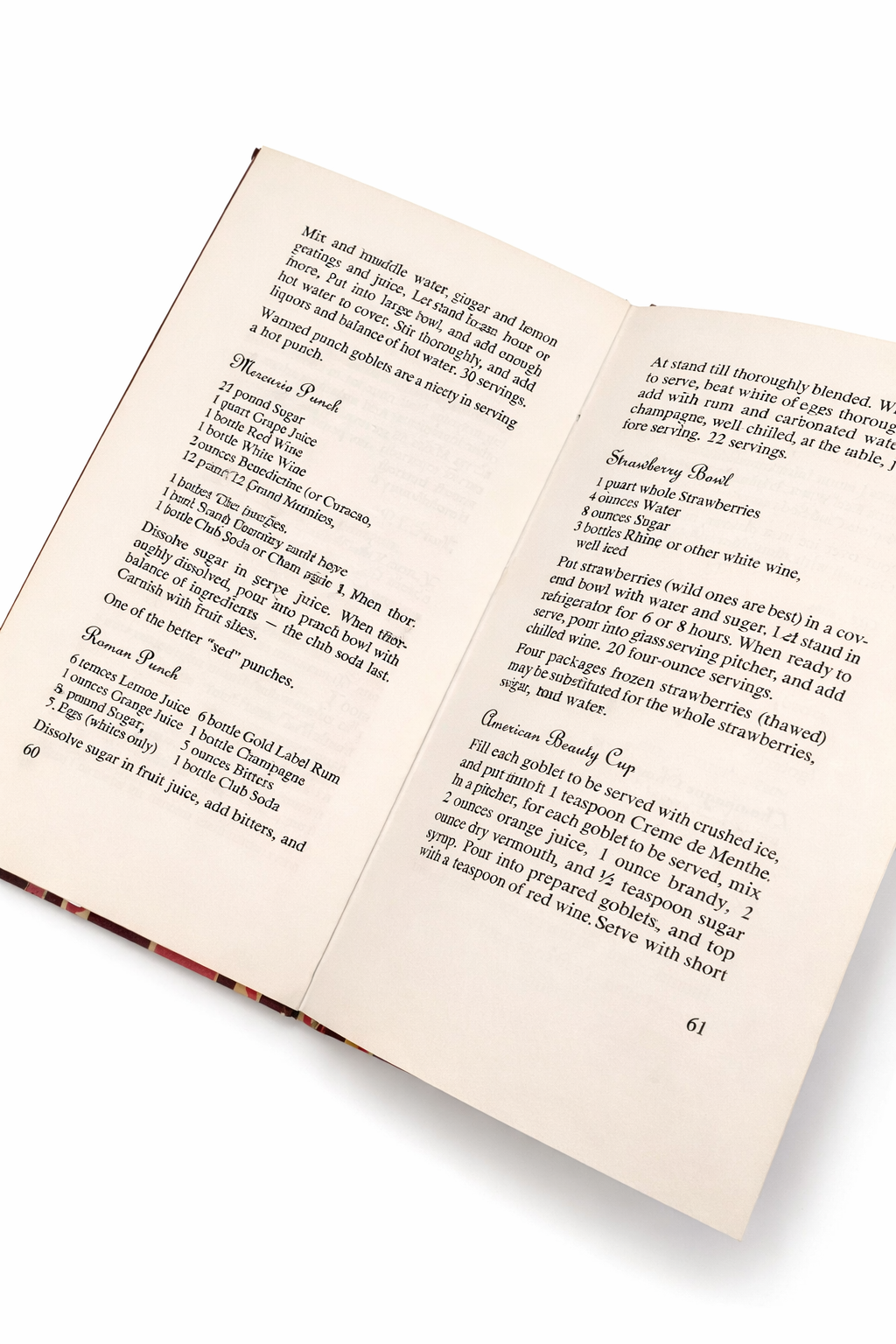 Interior pages of Peter Pauper’s Drink Book showing classic punch and cocktail recipes