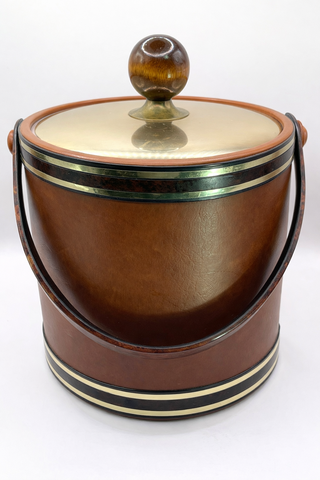 Vintage brown Kraftware ice bucket with tortoiseshell lucite swing handle and brass band detail
