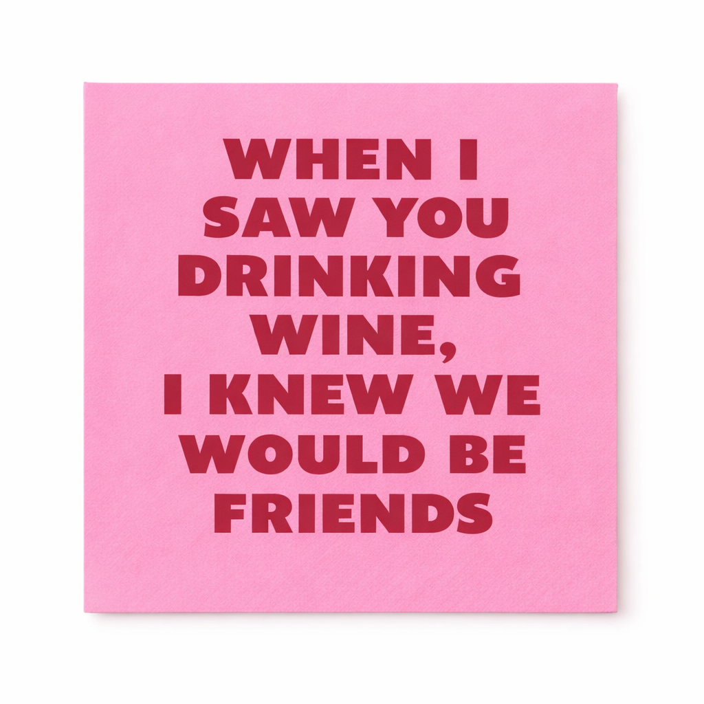 Pink cocktail napkin with quote When I Saw You Drinking Wine I Knew We Would Be Friends in bold red text