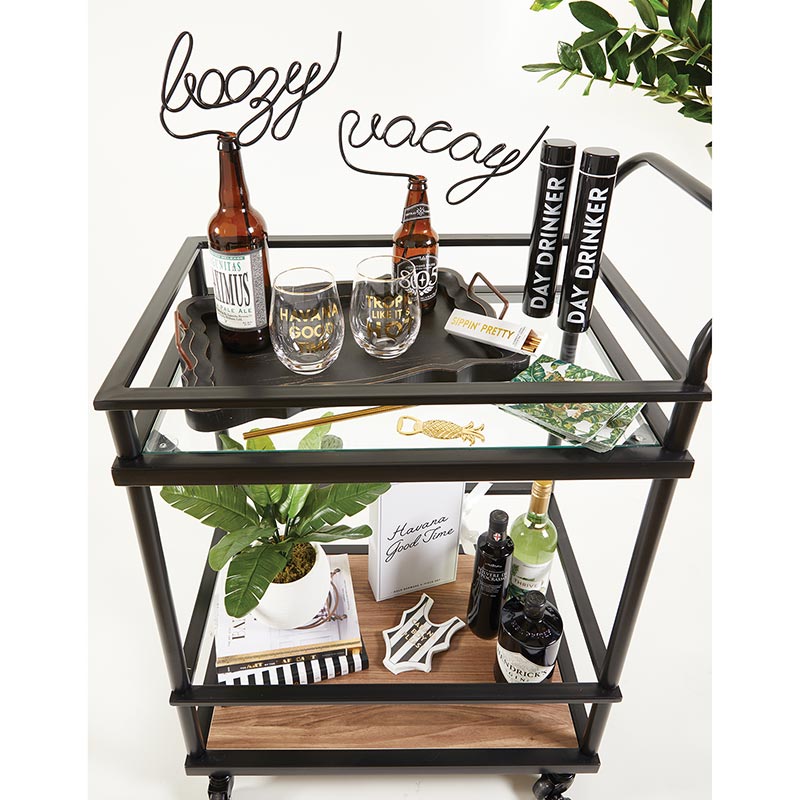 barware gift box displayed with coordinating gift items on a black bar cart