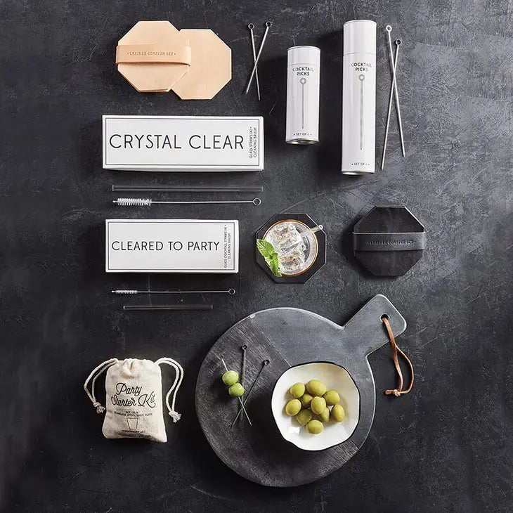 cocktail picks displayed with other coordinating items on a dark surface