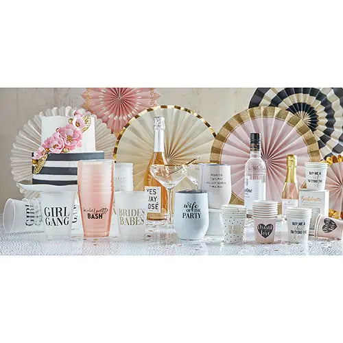 16 oz frosted plastic cup with bold, black words that say "girl gang" dispalyed on a table set for a party using pink, gold, and black and white decorations