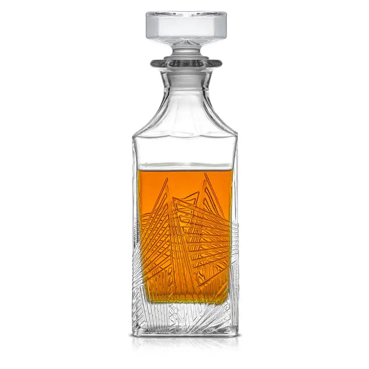 clear, lead free glass whiskey decanter in an art deco design featuring delicate geometric lines and an airtight top