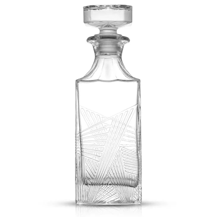 clear, lead free glass whiskey decanter in an art deco design featuring delicate geometric lines and an airtight top