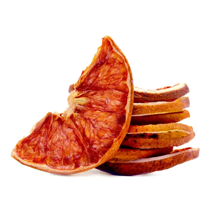 dehydrated grapefruit slices stacked for display of their rich color