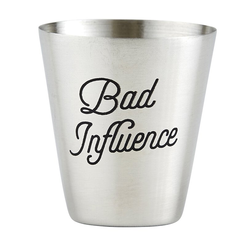 close up of stainless steel shot cup with "Bad Influence" etched into the cup